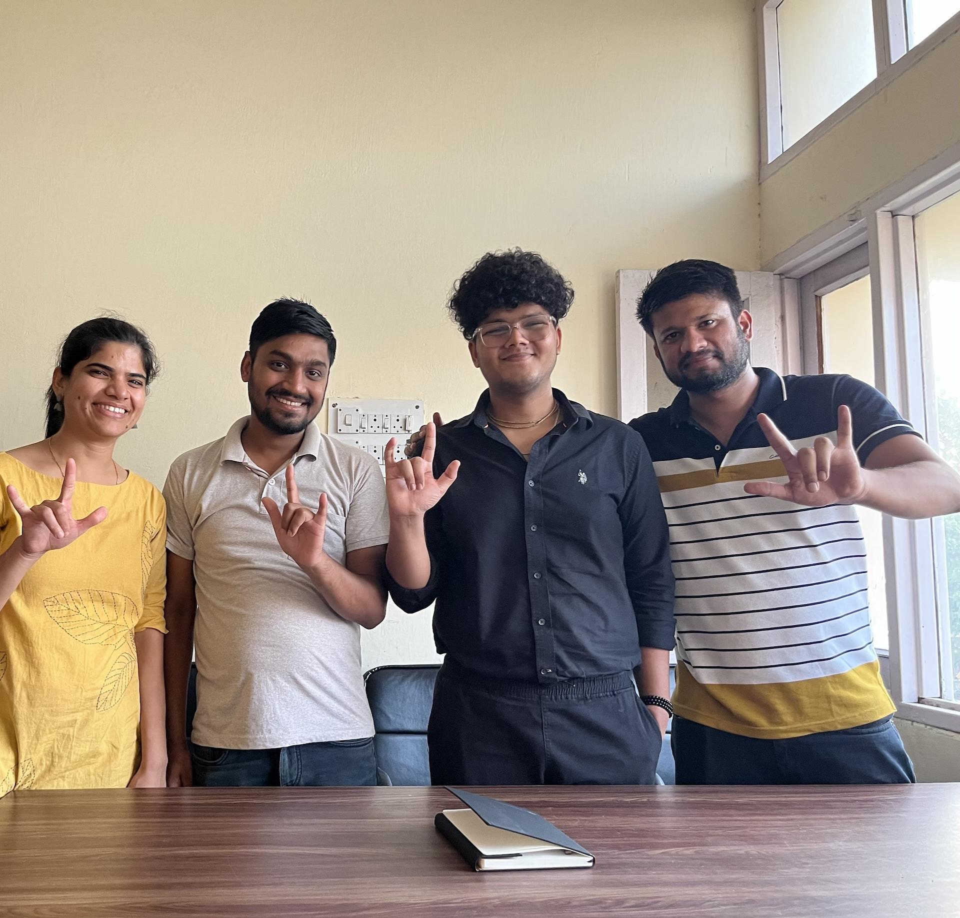Members of the Thinklude team signing together